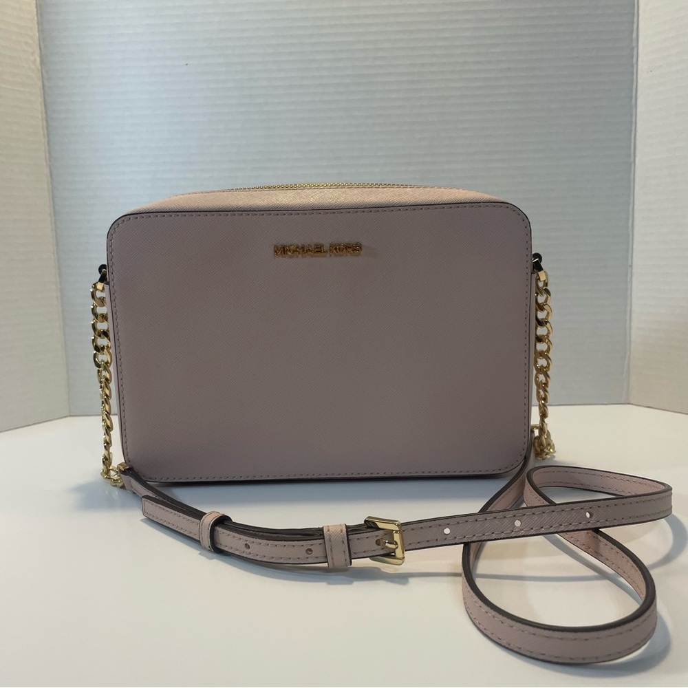 Michael Kors Pink and Gold Crossbody Bag with Sleek Design